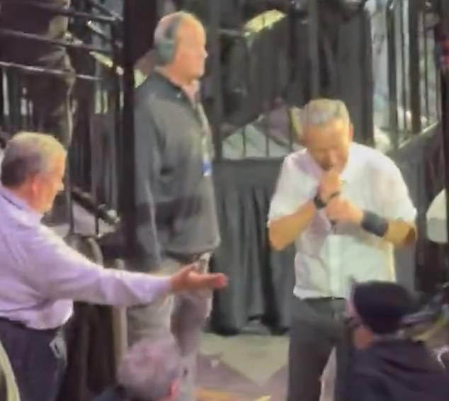 Bruce Springsteen walks past Chris Christie during concert encore, sparking viral debate.